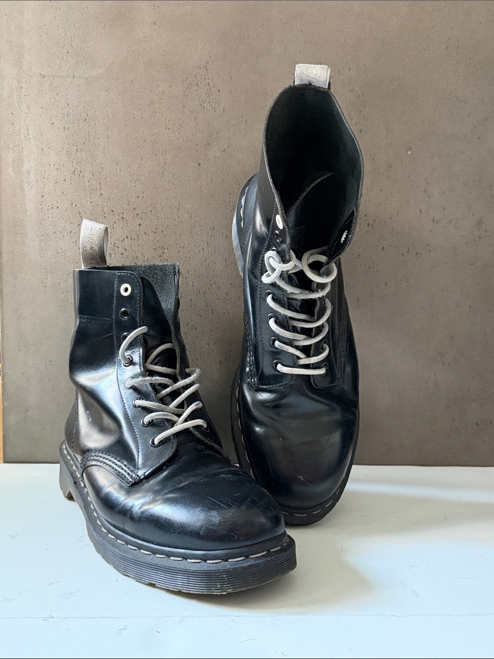 Dr. Martens Black Leather Lace-Up Boots with Light Gray Laces